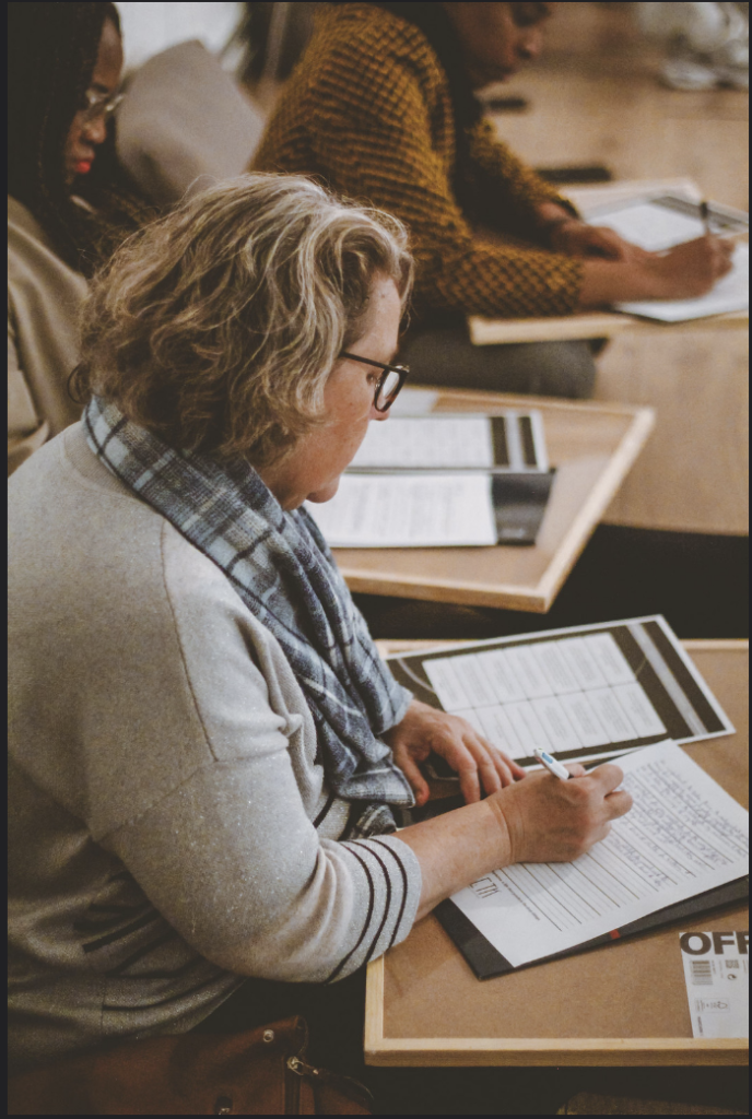 a woman leader setting foundational goals for her personal growth in a leadership workshop